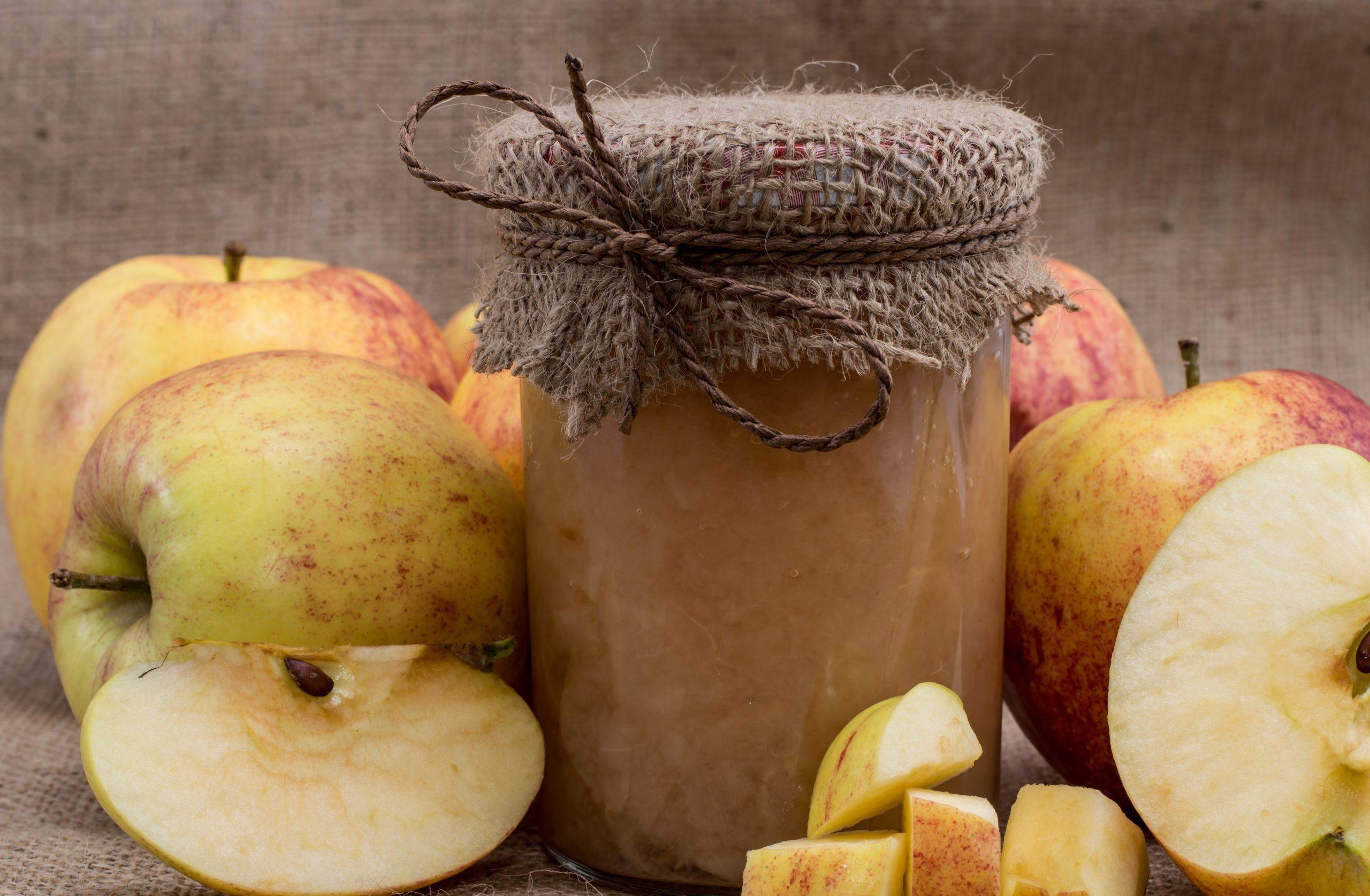 Jar of Brown Liquid with Sliced Apples