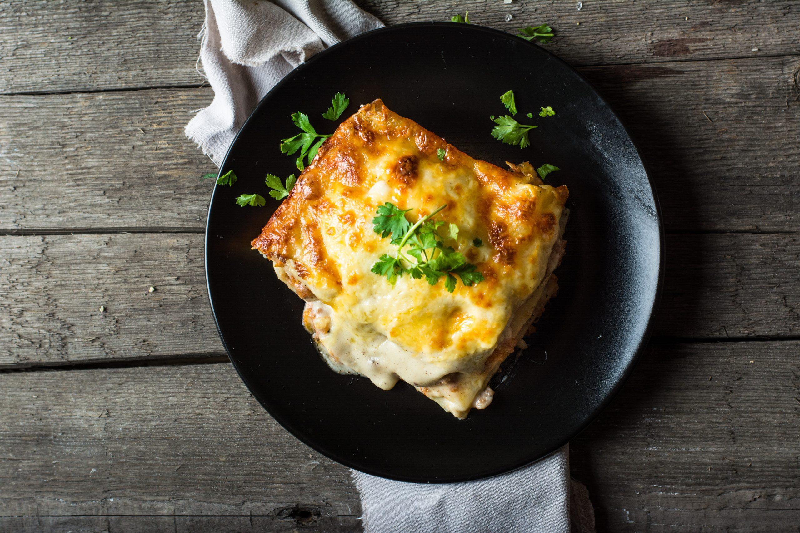 Cheesy Pizza on Wooden Plate