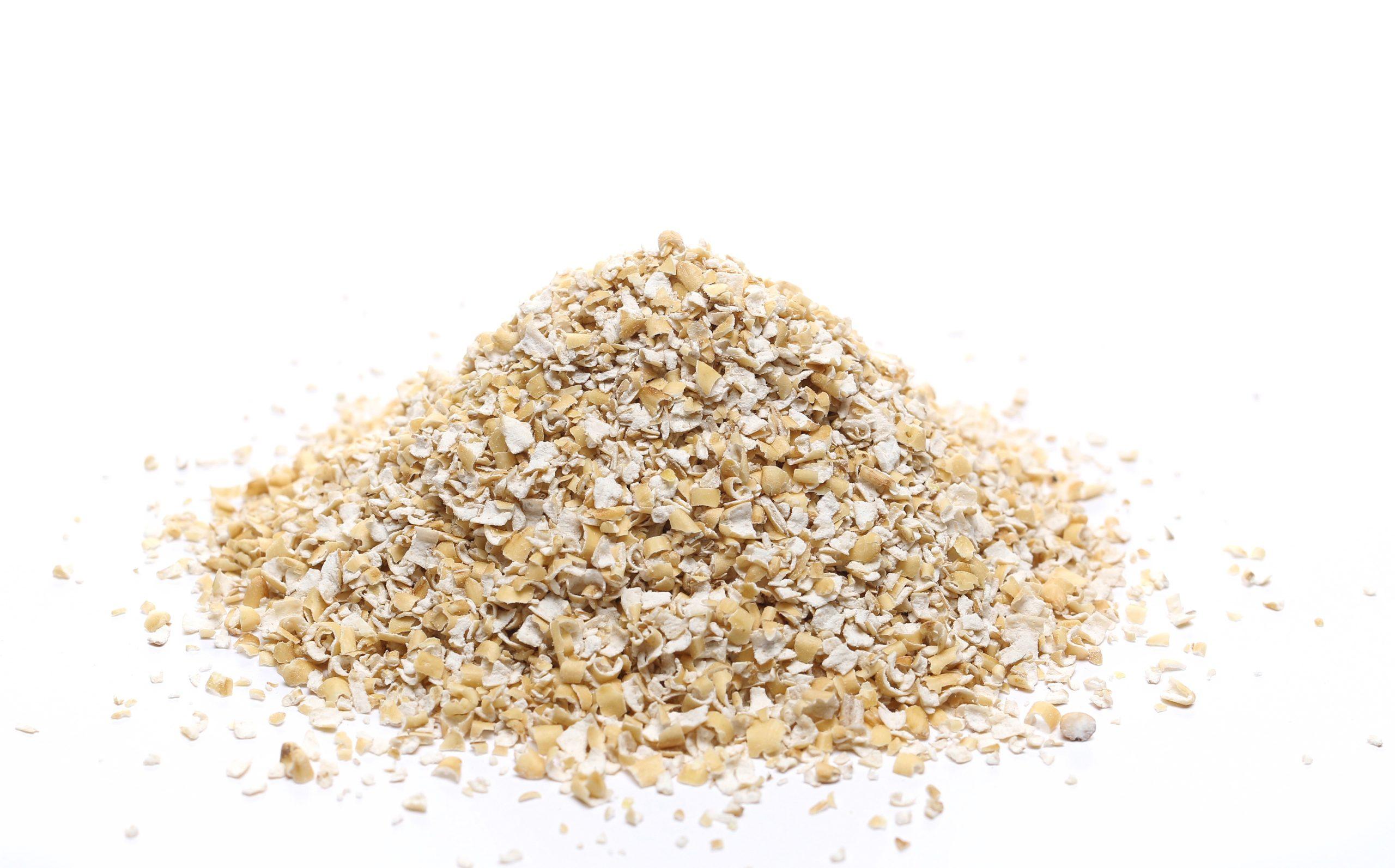 Pile of Raw Oats on White Background