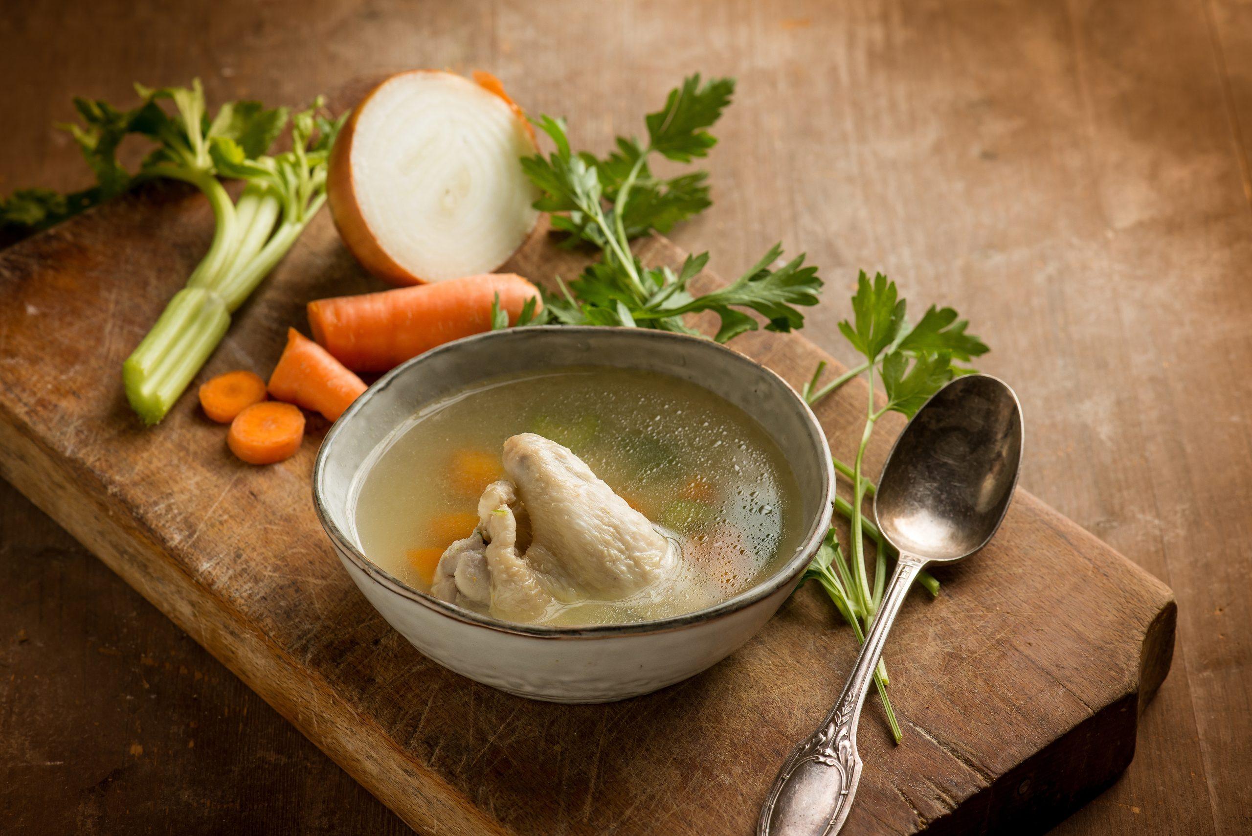 Hearty Vegetable Soup with Wooden Spoon