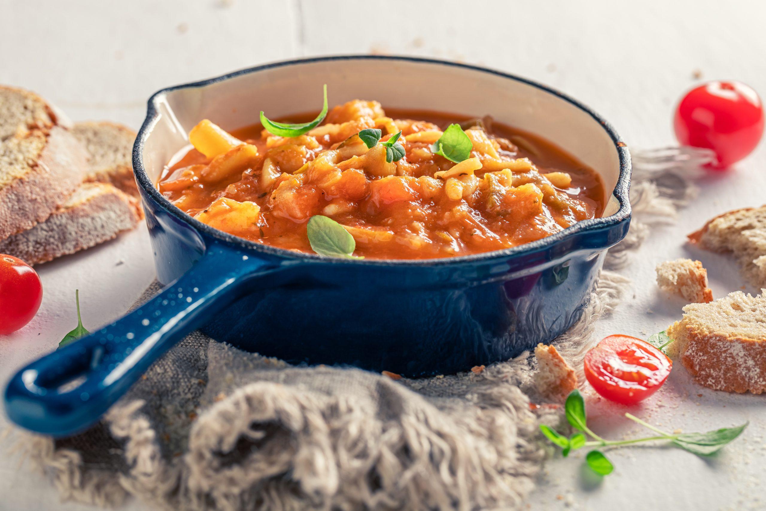 Hearty Stew with Carrots in Blue Pan