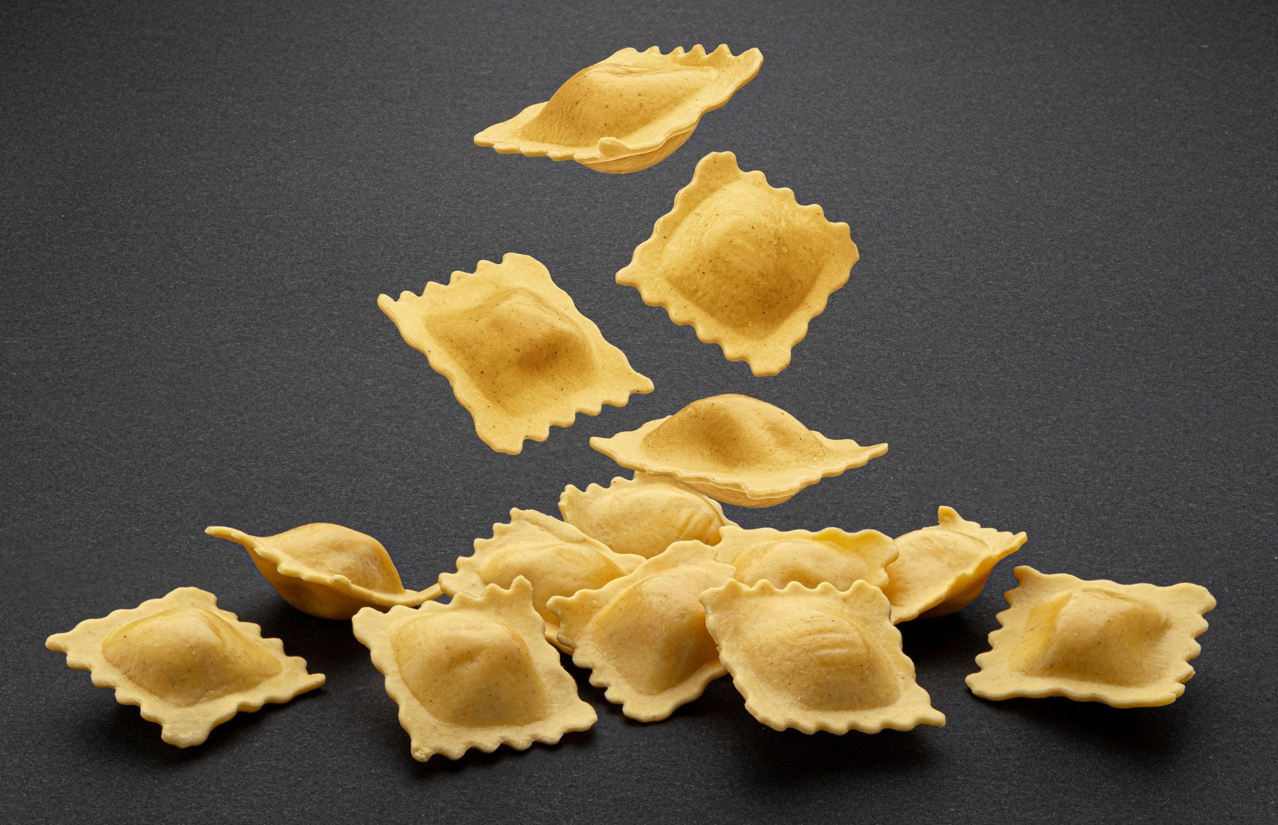 Raw Pasta on Black Surface