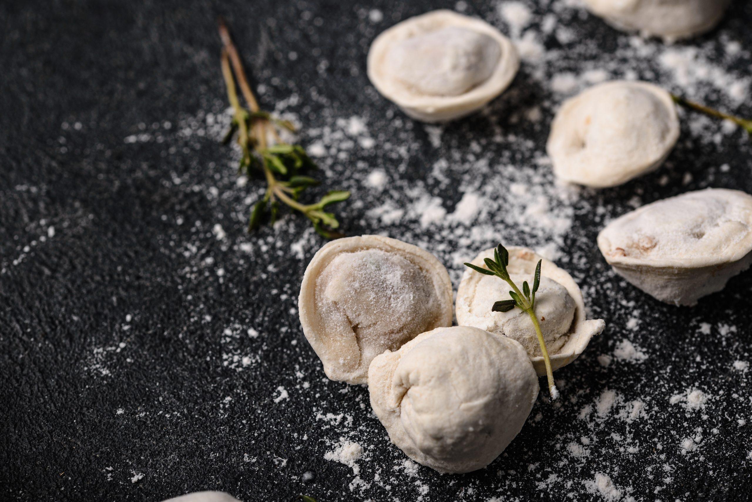 Assorted Dumplings on Black Surface
