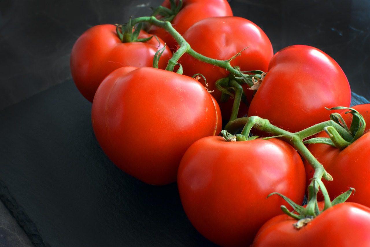 Assorted Tomatoes on Black Surface
